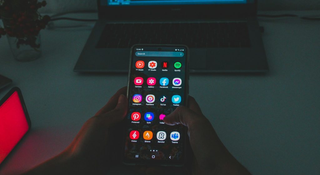 black android smartphone turned on displaying icons