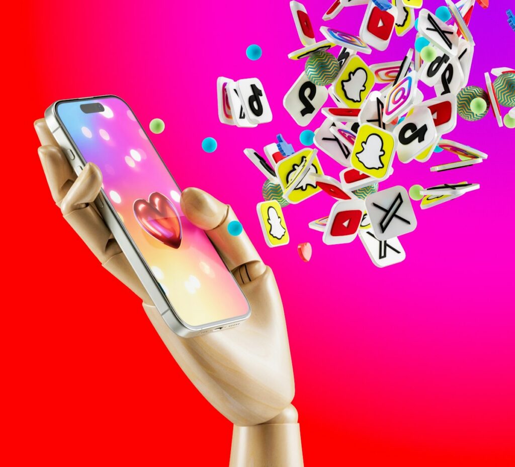 a hand holding a cell phone with a lot of stickers coming out of it